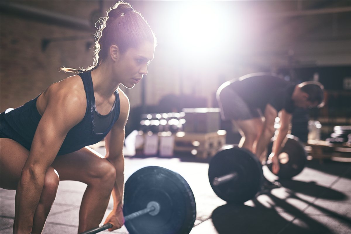 Woman preparing to lift a barbell