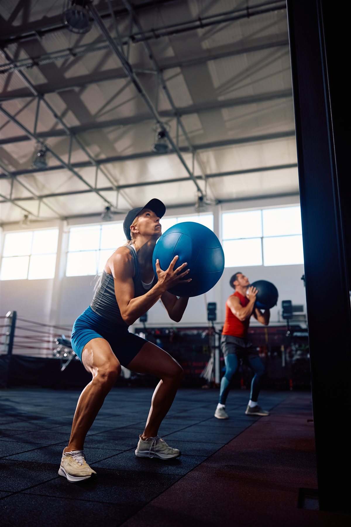 Woman performing a medicine ball squat