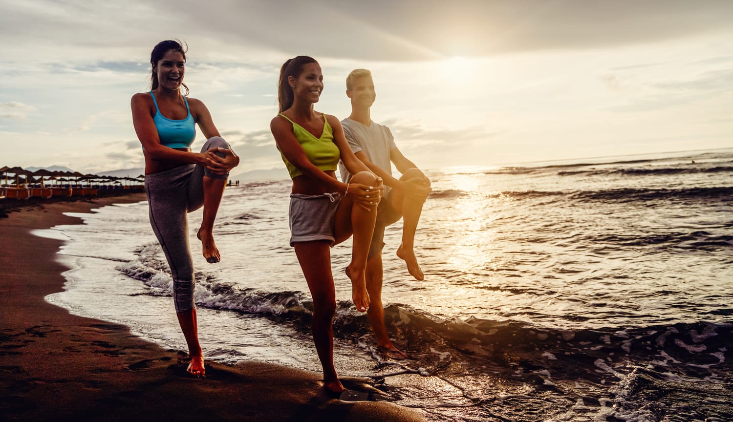 People enjoying a healthy lifestyle on the beach