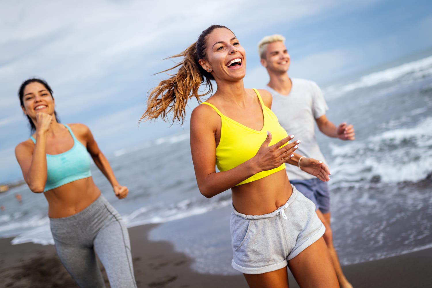 VESSL members jogging on the beach